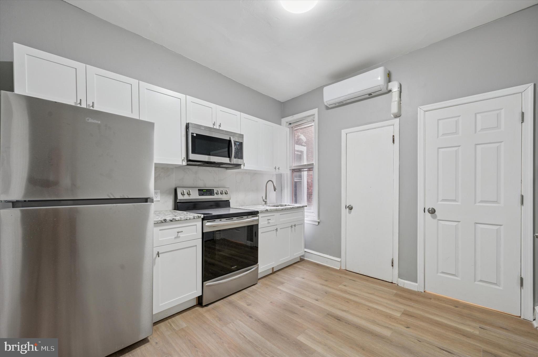 249 South 44th Street, Unit 4 Philadelphia, PA 19104 - Photo 7 of 25 a kitchen with a refrigerator stove and sink