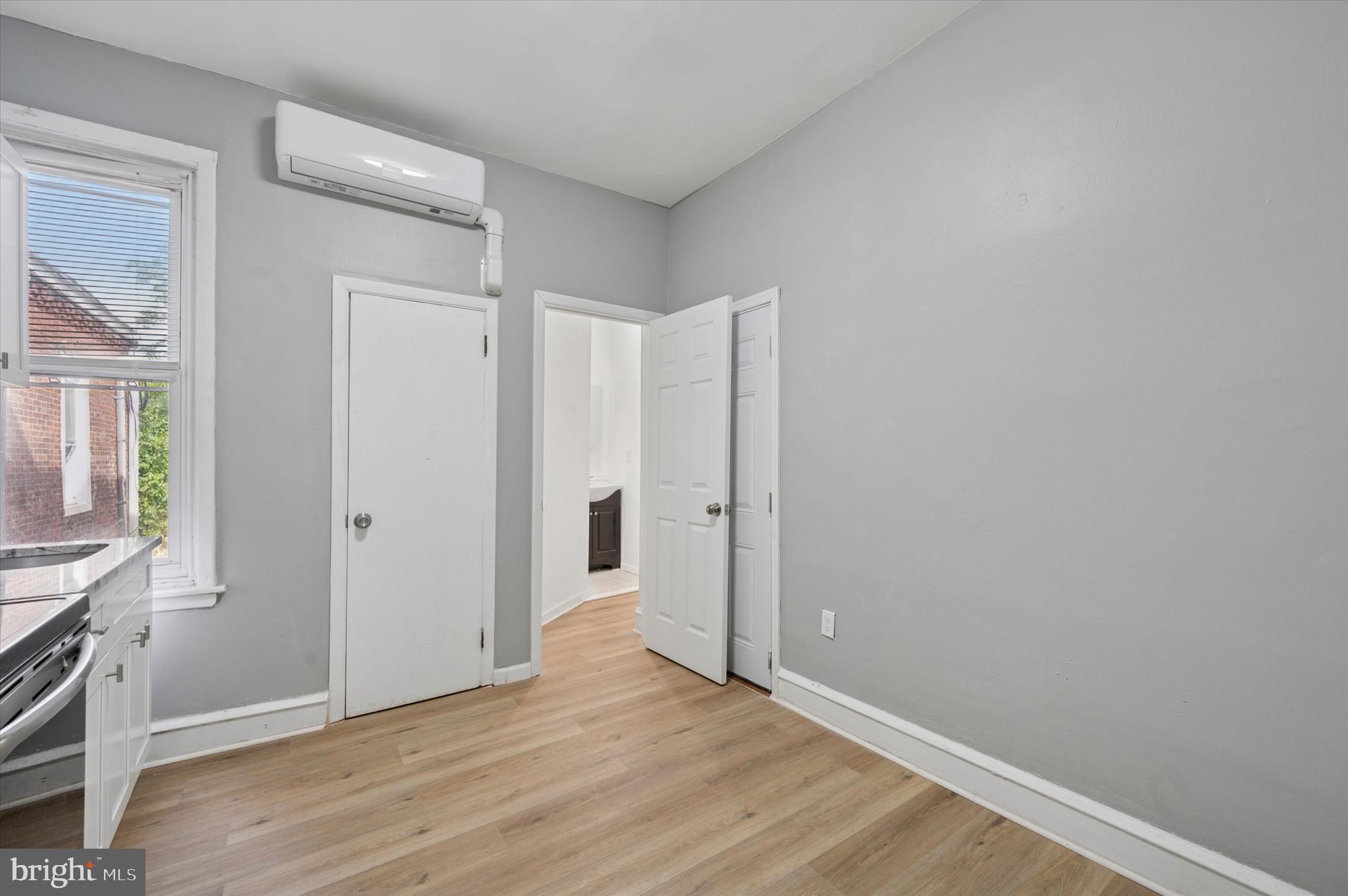 249 South 44th Street, Unit 4 Philadelphia, PA 19104 - Photo 8 of 25 a view of an empty room with wooden floor and a window