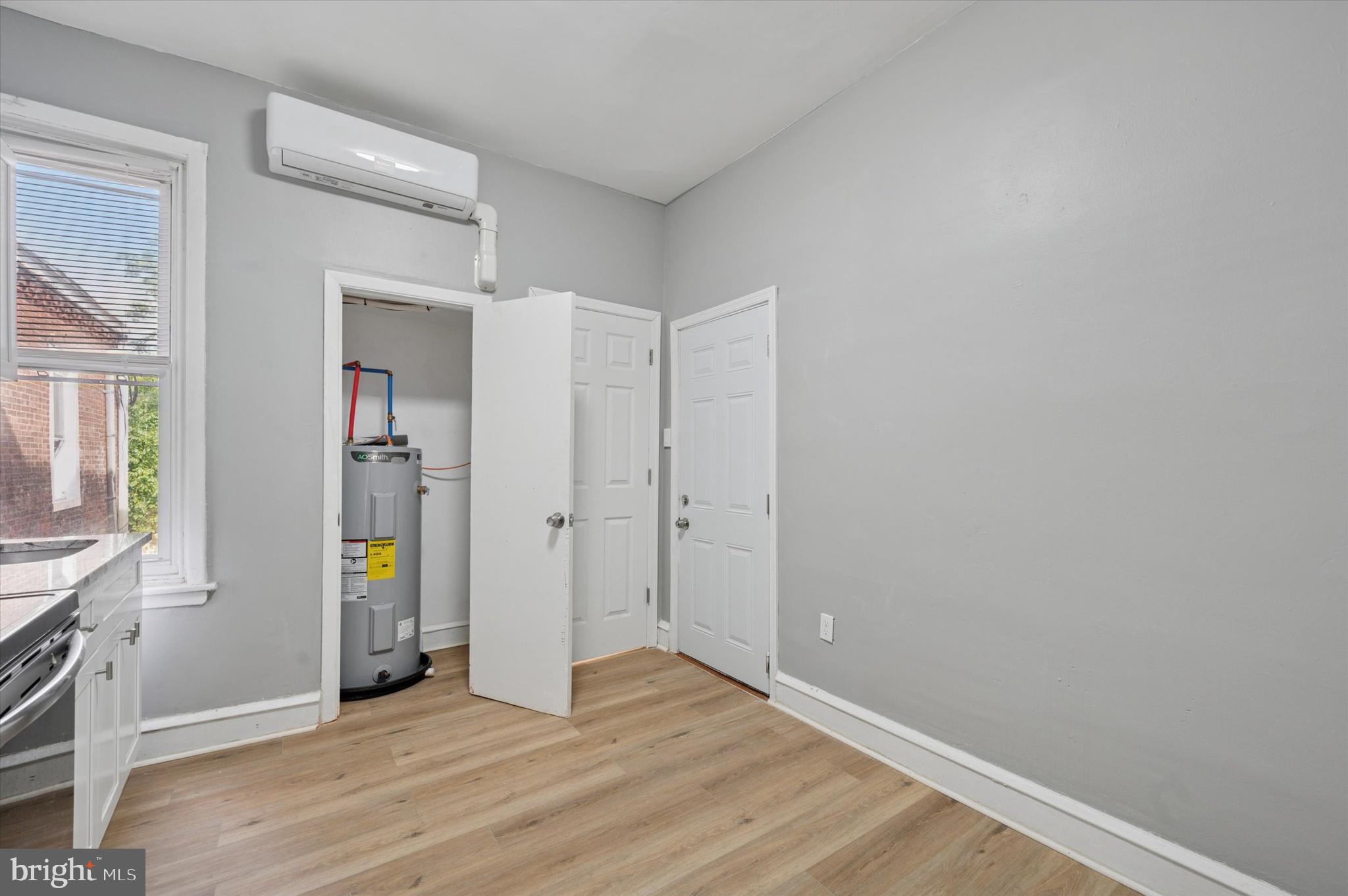 249 South 44th Street, Unit 4 Philadelphia, PA 19104 - Photo 9 of 25 a view of an empty room with wooden floor and a window