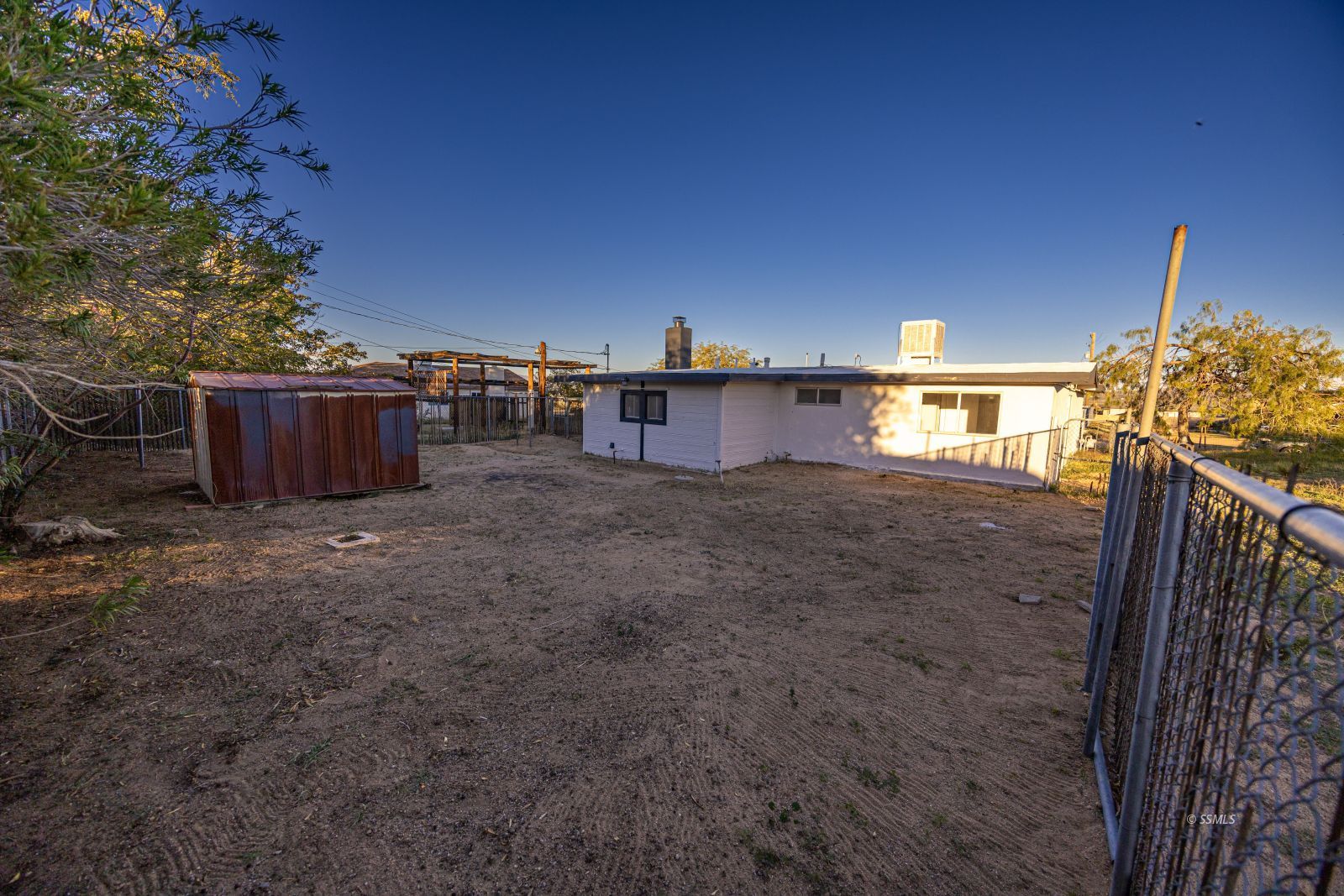 1525 South Porter Ridgecrest, CA 93555 - Photo 29 of 29 a view of a house with backyard and a tree