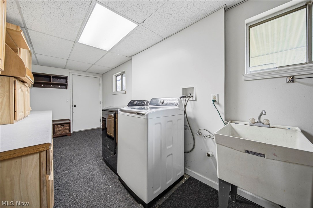 10397 Prouty Road Painesville, OH 44077 - Photo 23 of 32 Laundry area with a paneled ceiling and washer and clothes dryer