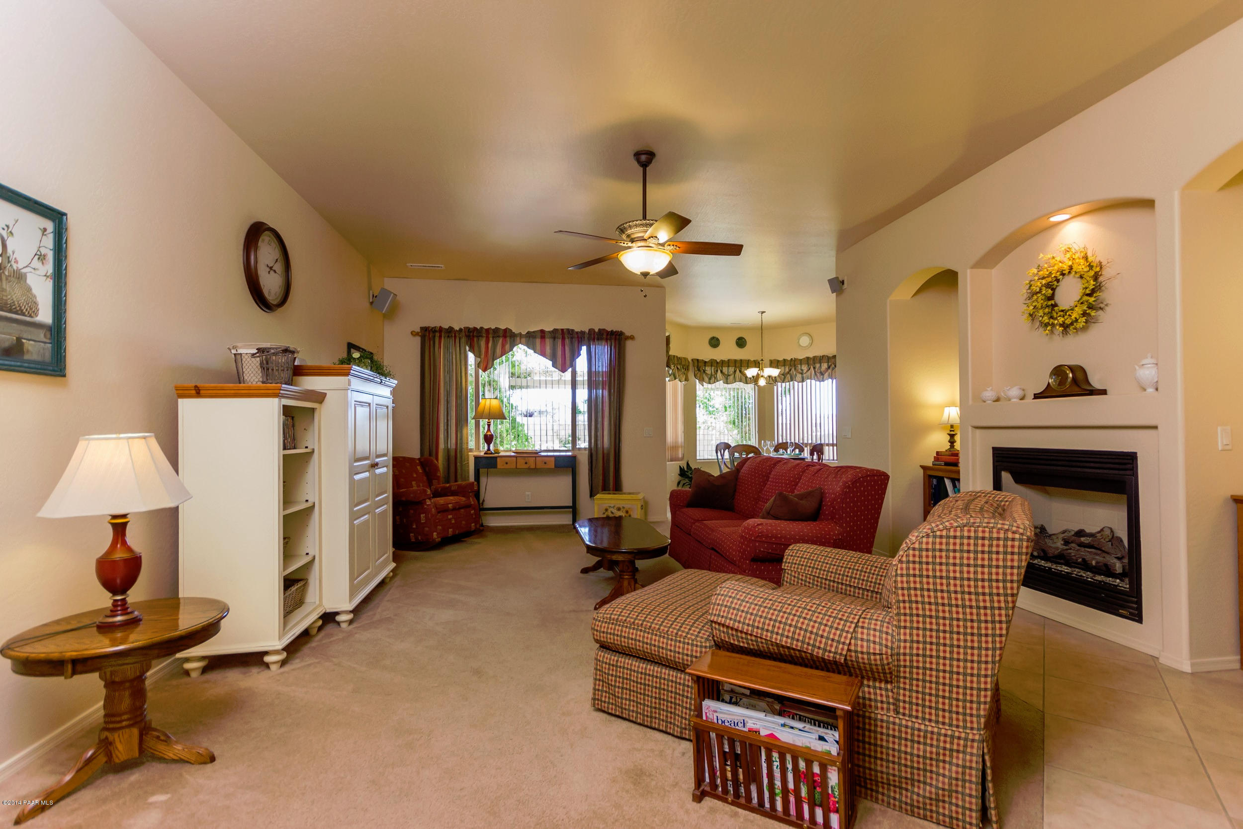 4714 Edgemont Road Prescott Valley, AZ 86314 - Photo 10 of 30 a living room with furniture and a fireplace
