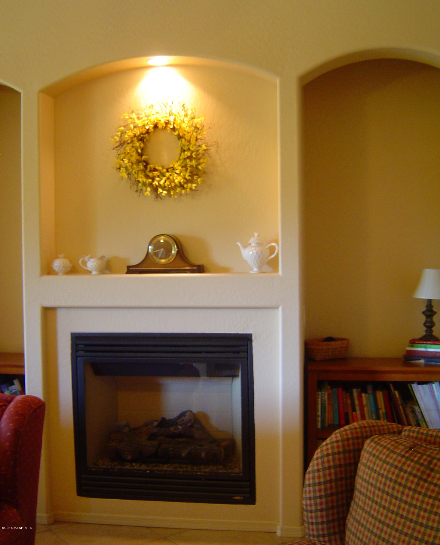 4714 Edgemont Road Prescott Valley, AZ 86314 - Photo 11 of 30 a view of living room with a fireplace and a table