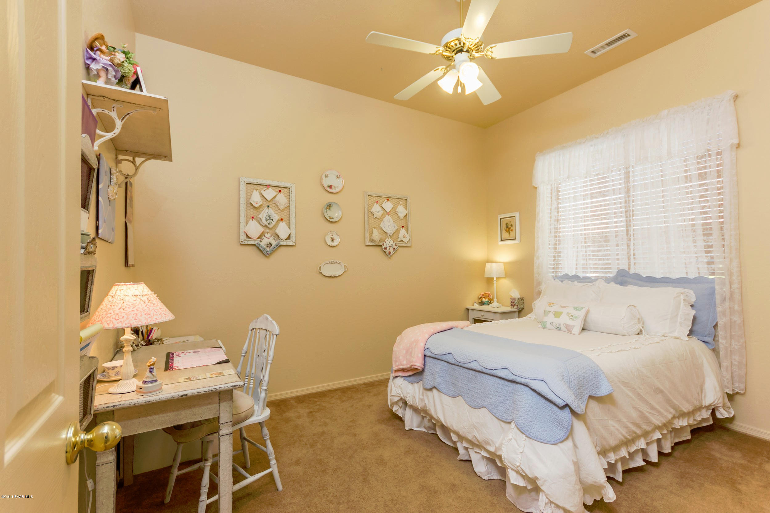 4714 Edgemont Road Prescott Valley, AZ 86314 - Photo 15 of 30 a bedroom with a bed and a chandelier