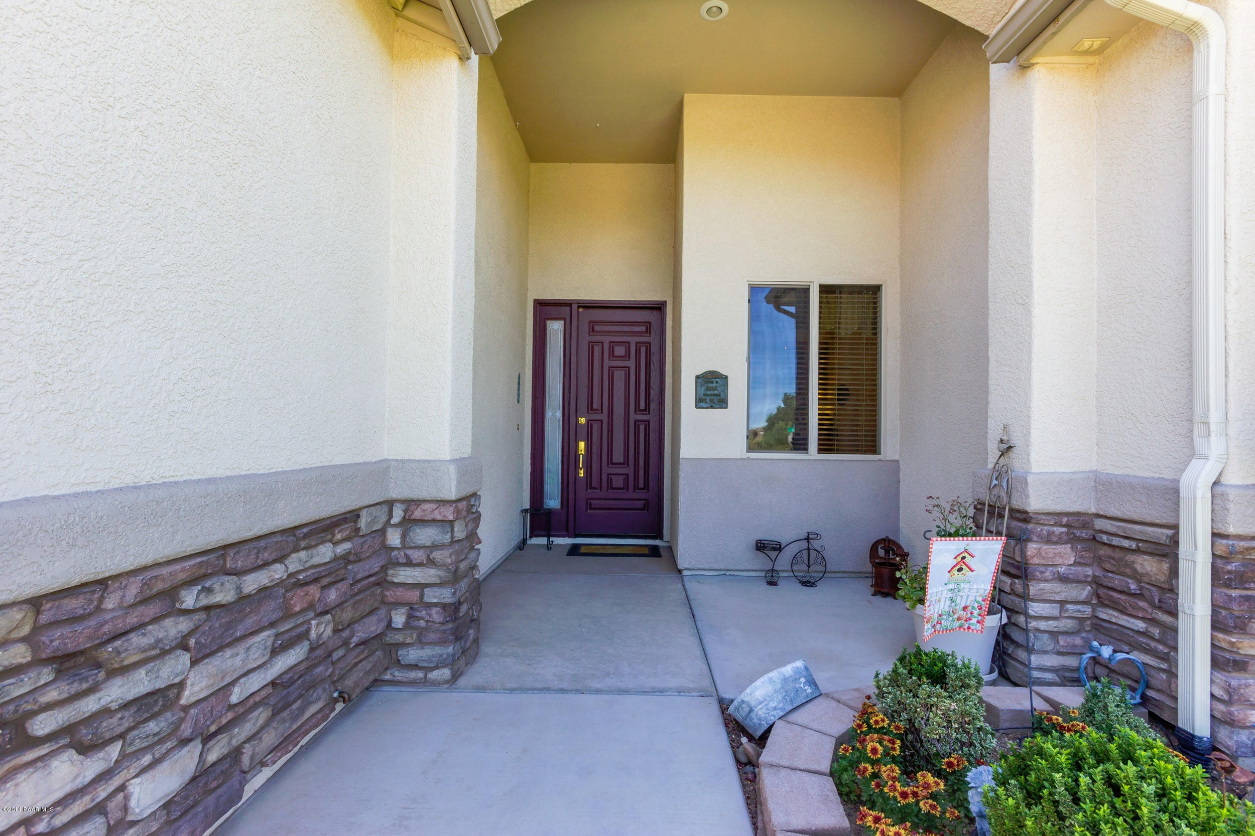 4714 Edgemont Road Prescott Valley, AZ 86314 - Photo 3 of 30 a view of an entryway with wooden floor and mirror
