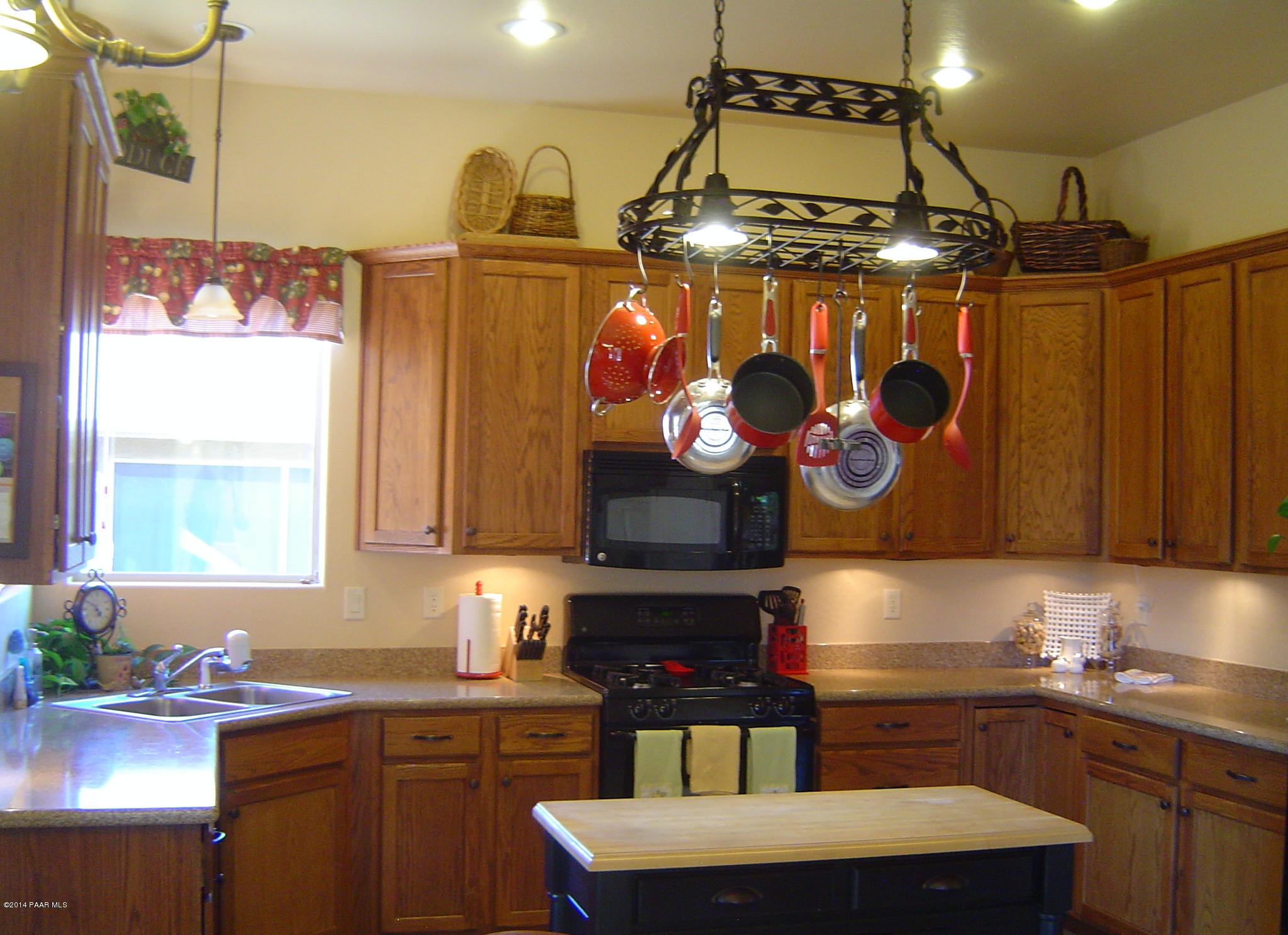 4714 Edgemont Road Prescott Valley, AZ 86314 - Photo 7 of 30 a kitchen with a stove and a refrigerator