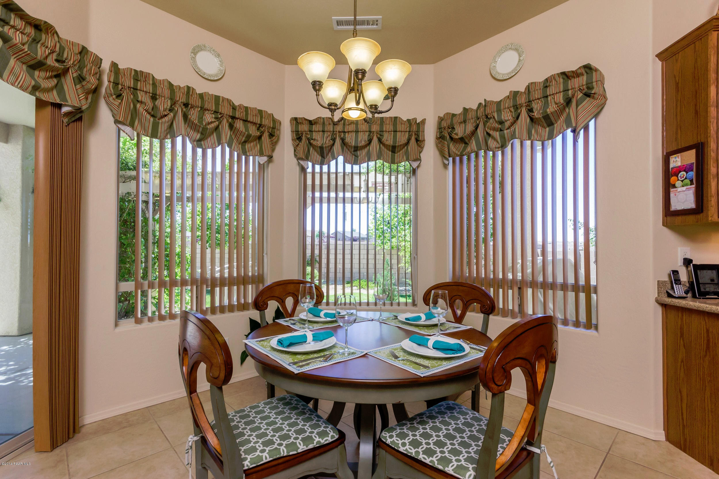 4714 Edgemont Road Prescott Valley, AZ 86314 - Photo 8 of 30 a view of a dining room with furniture and chandelier