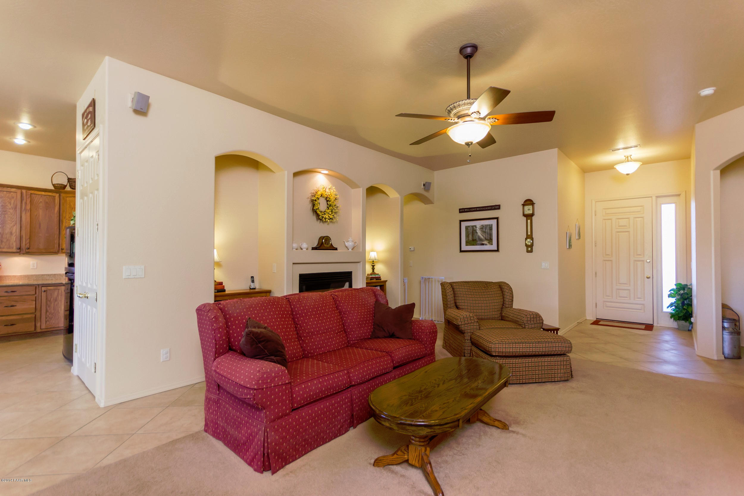 4714 Edgemont Road Prescott Valley, AZ 86314 - Photo 9 of 30 a living room with furniture and a chandelier