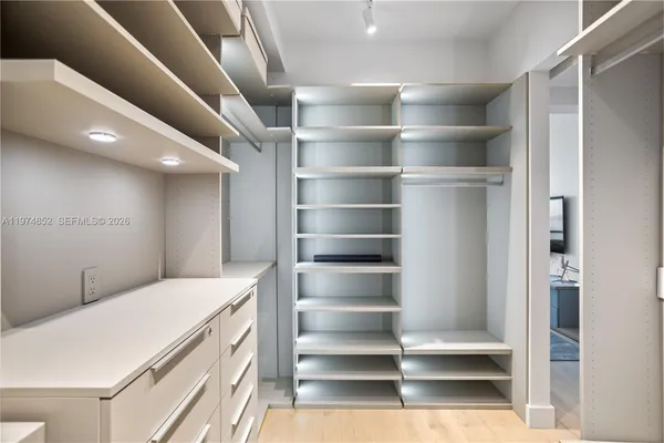 a view of an empty walk in closet