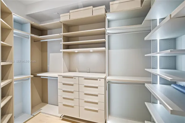 a view of an empty walk in closet