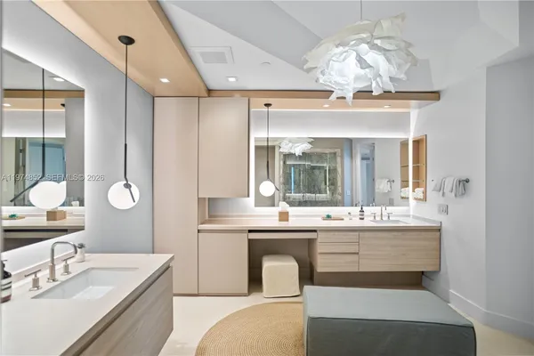 a large kitchen with a sink and stove