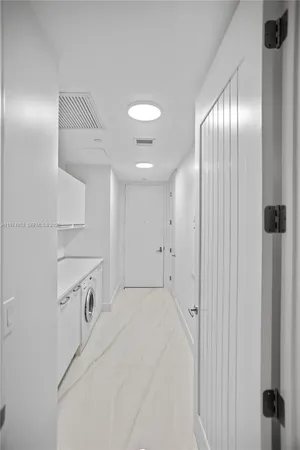 a view of a hallway with granite countertop