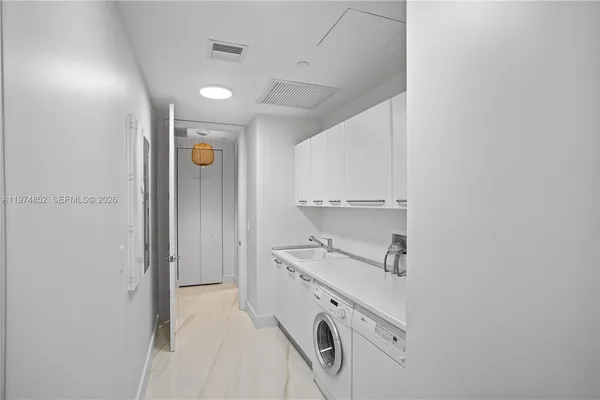 a view of cabinets and wooden floor
