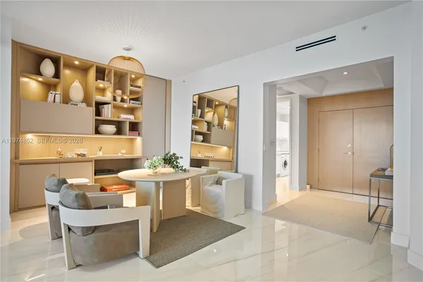 a dining room with a table and chairs