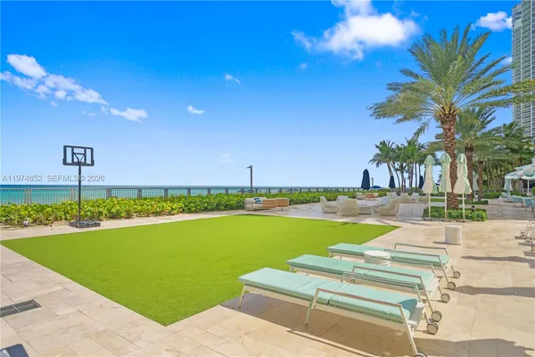 a view of a swimming pool and a yard