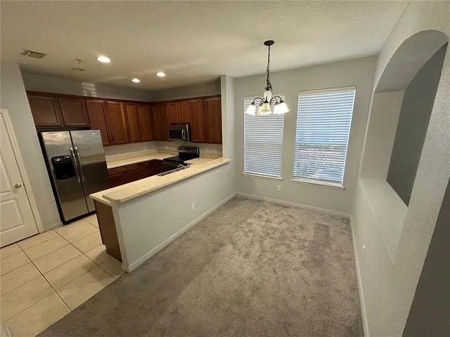 a view of empty room with windows