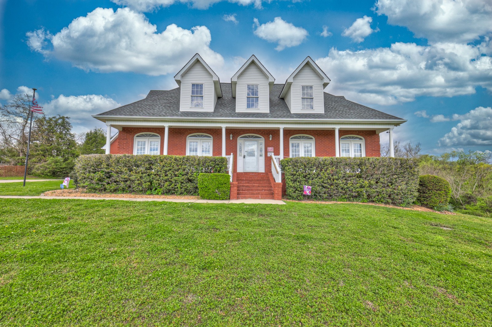 a front view of a house with a yard