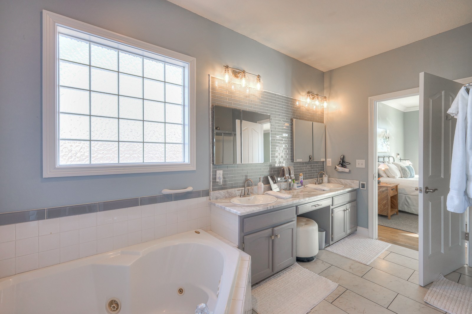 5784 Rock Springs Road Smyrna, TN 37167 - Photo 48 of 74 a bathroom with a tub sink and mirror