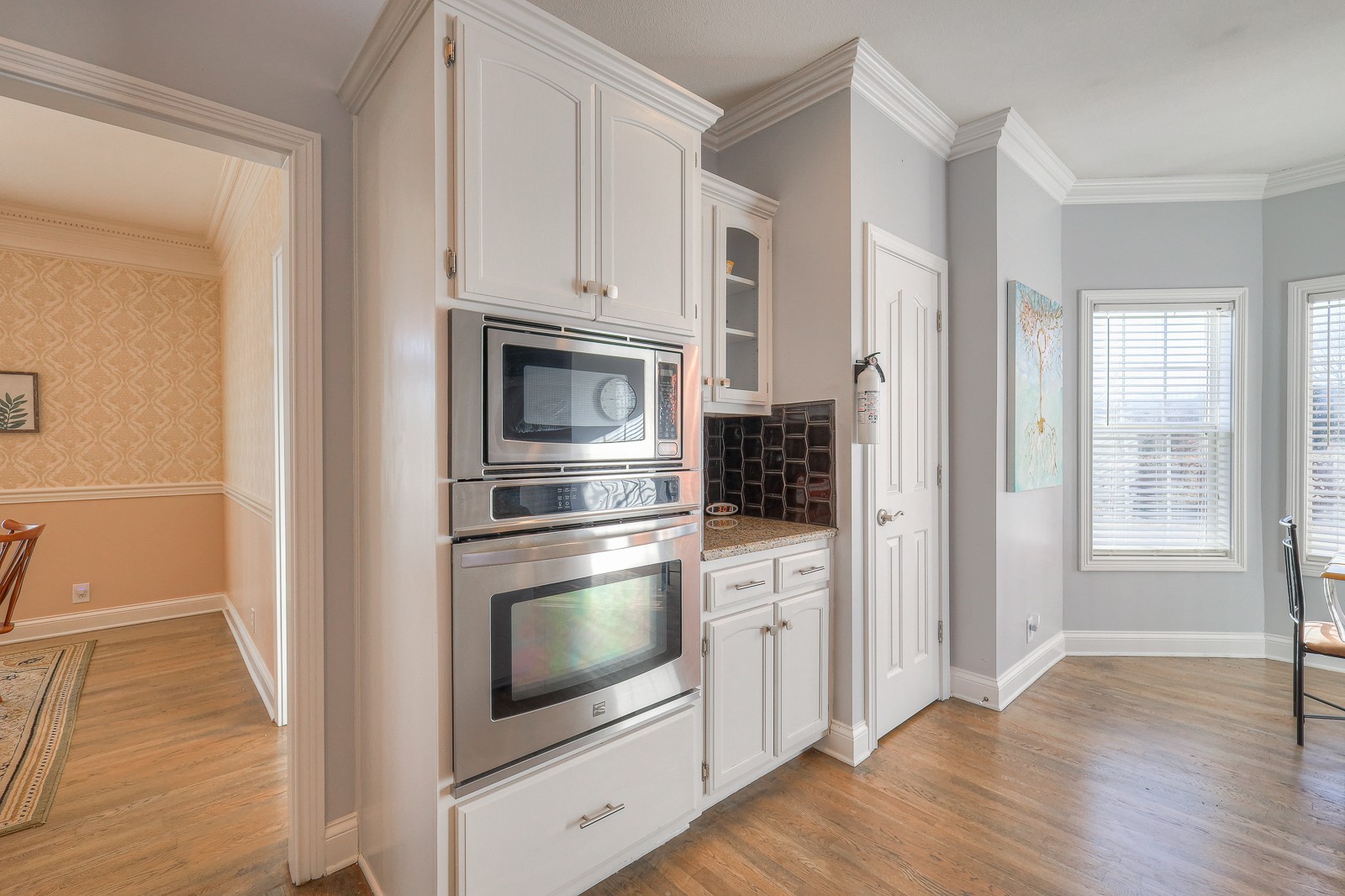 5784 Rock Springs Road Smyrna, TN 37167 - Photo 58 of 74 a kitchen with white cabinets and stainless steel appliances
