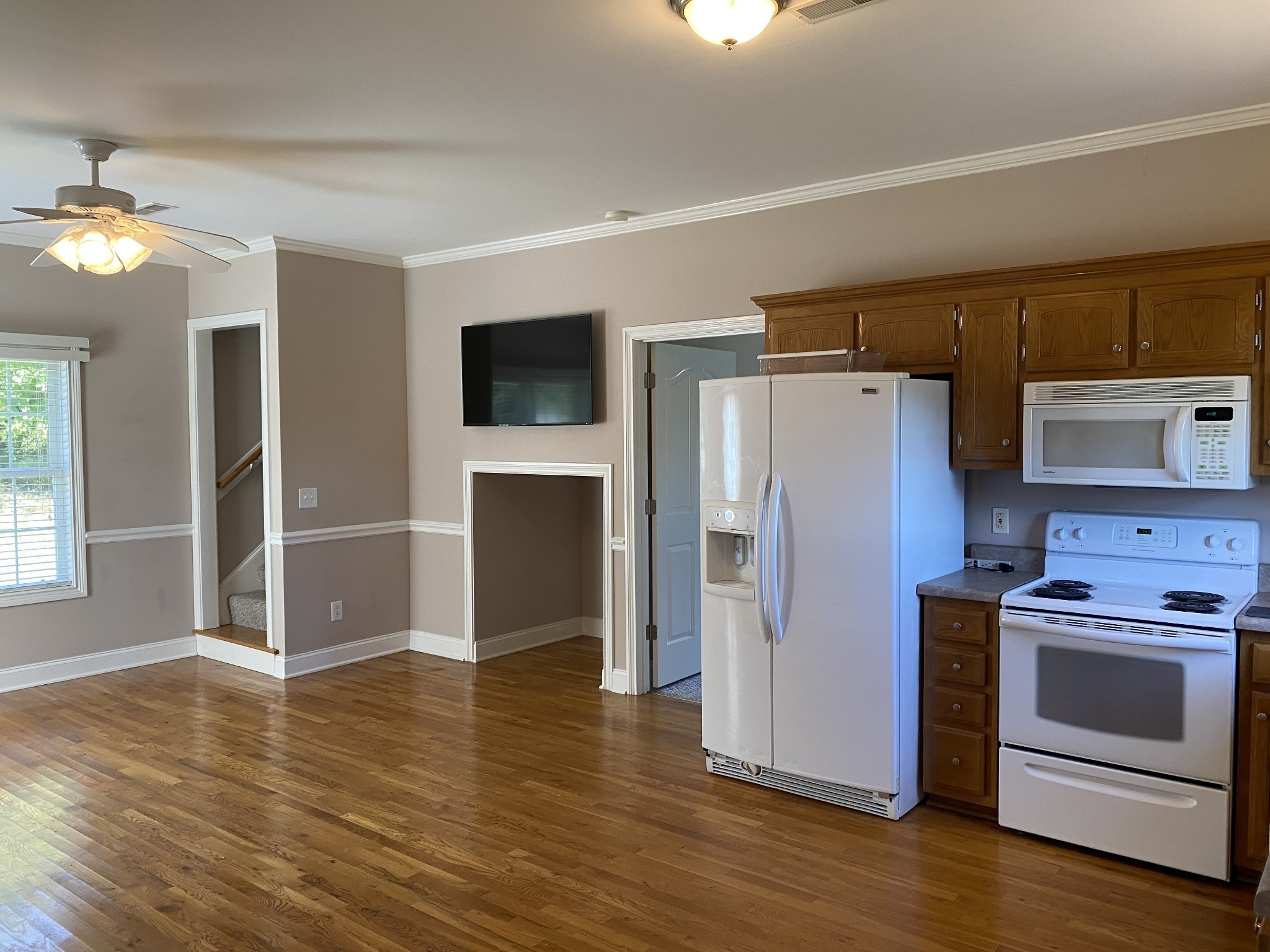 5784 Rock Springs Road Smyrna, TN 37167 - Photo 74 of 74 a kitchen with a refrigerator stove and wooden floor