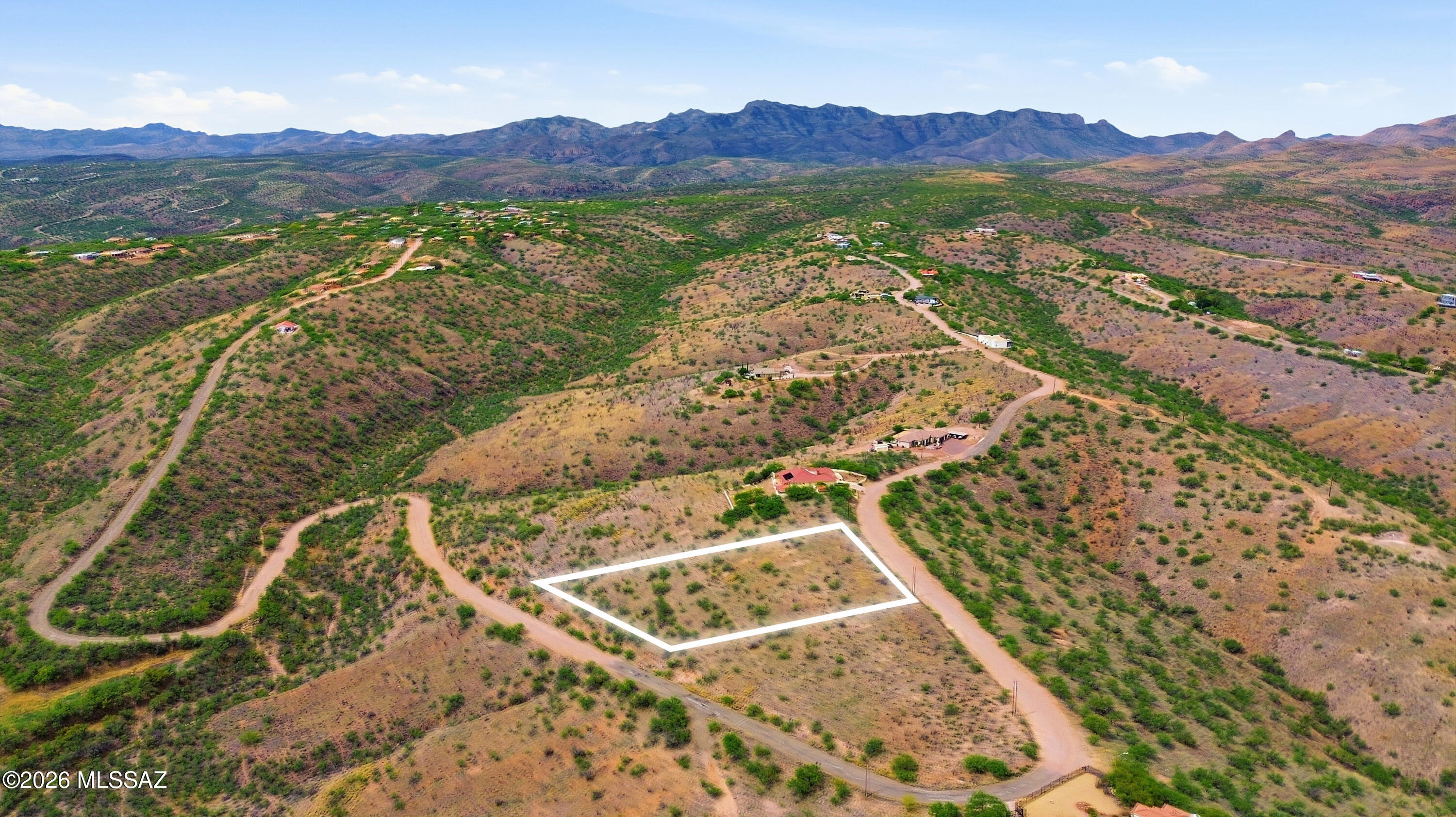 1525 Circulo Jacona, Unit 32 Rio Rico, AZ 85648 - Photo 5 of 13 a view of a backyard with a lake