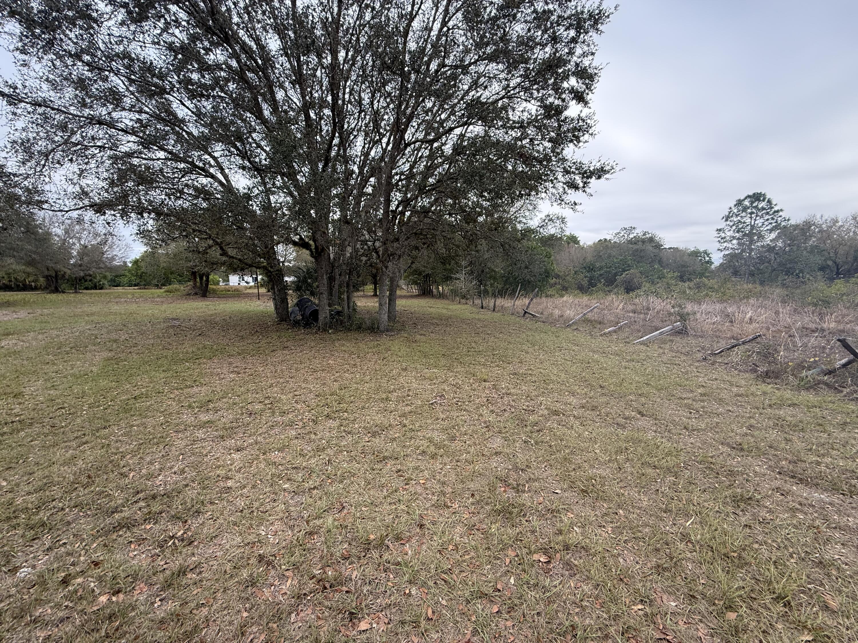754 Hunting Club Avenue Clewiston, FL 33440 - Photo 12 of 31 a view of a field with trees in background