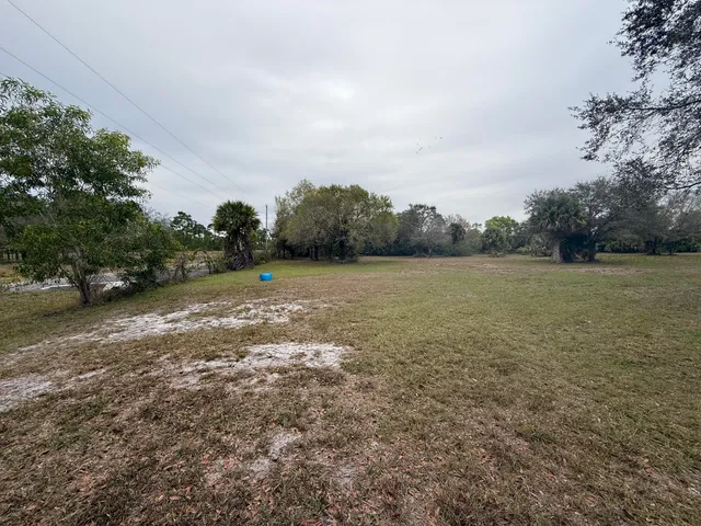 a view of outdoor space with deck and yard