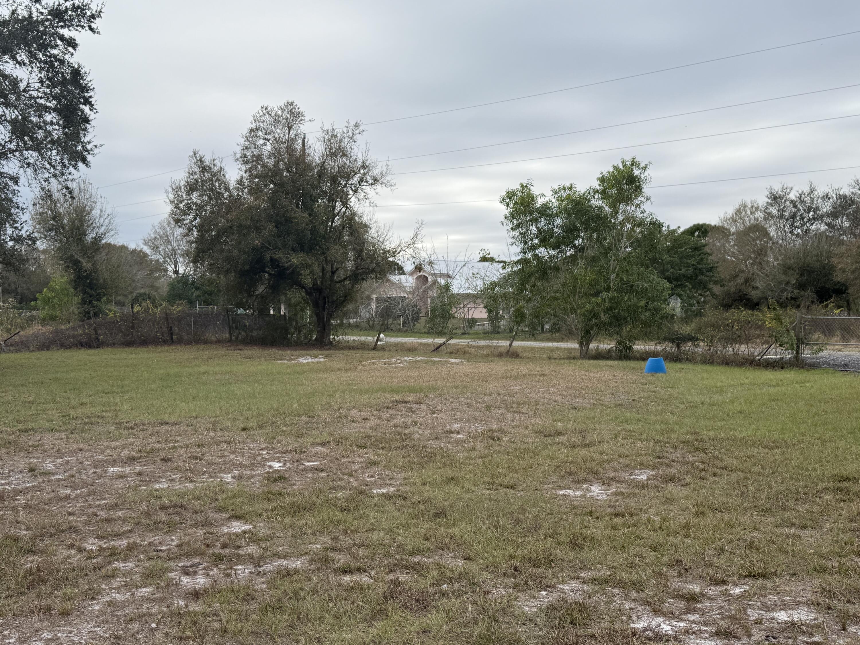 754 Hunting Club Avenue Clewiston, FL 33440 - Photo 6 of 31 a view of outdoor space with deck and yard