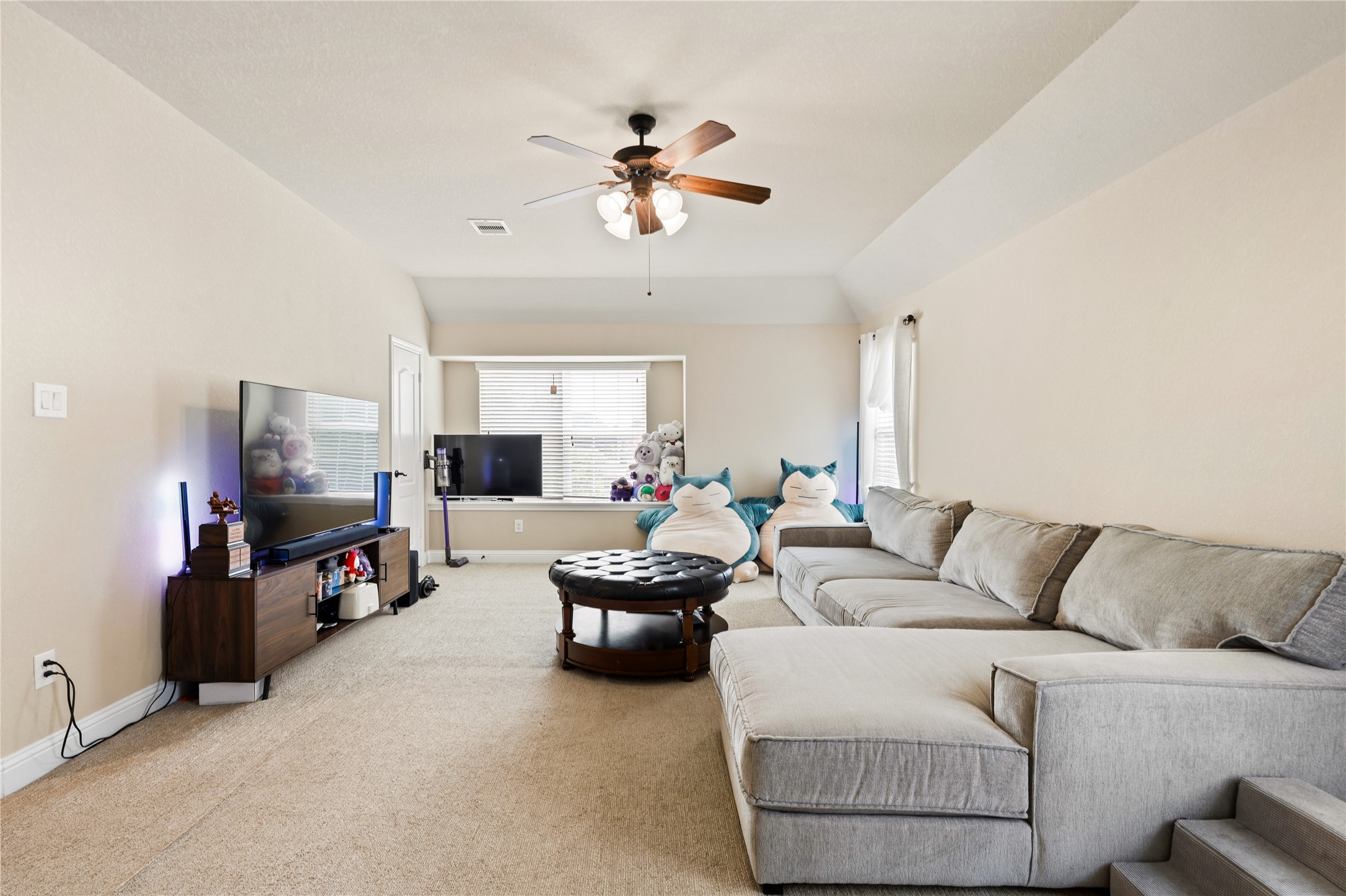 5802 Layton Meadows Lane Spring, TX 77379 - Photo 29 of 42 Second angle of the game room. Shows the full sectional, bay window, and how open the space is.