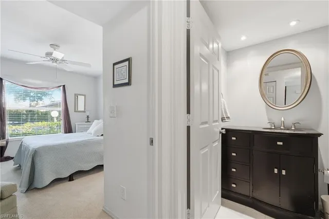 a spacious bathroom with a double vanity sink and a mirror