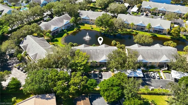 an aerial view of a house with yard swimming pool and outdoor seating