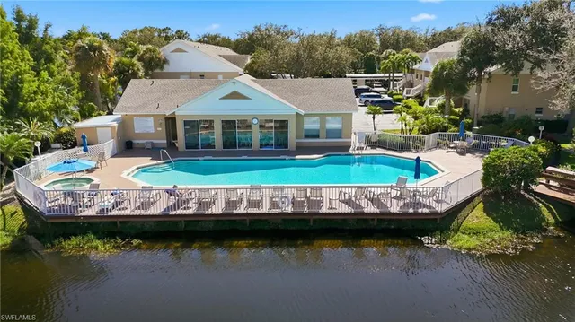 a view of house with garden space and sitting area