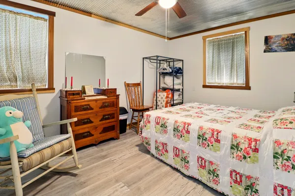 a bedroom with a bed and a dresser