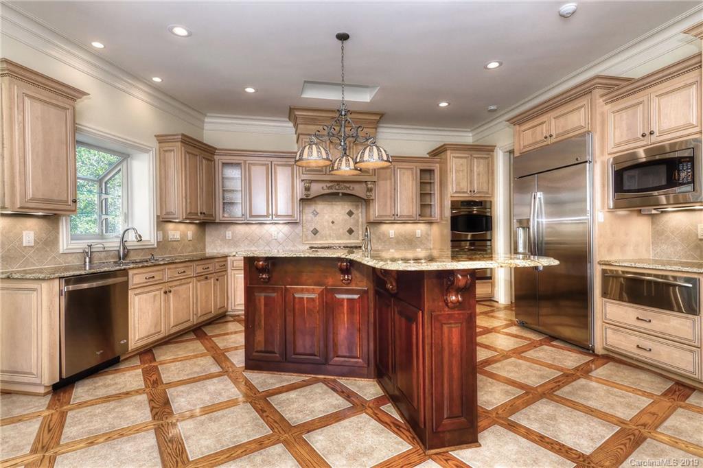 17415 Cabarrus Road Midland, NC 28107 - Photo 14 of 41 a large kitchen with granite countertop a large counter top stainless steel appliances and cabinets