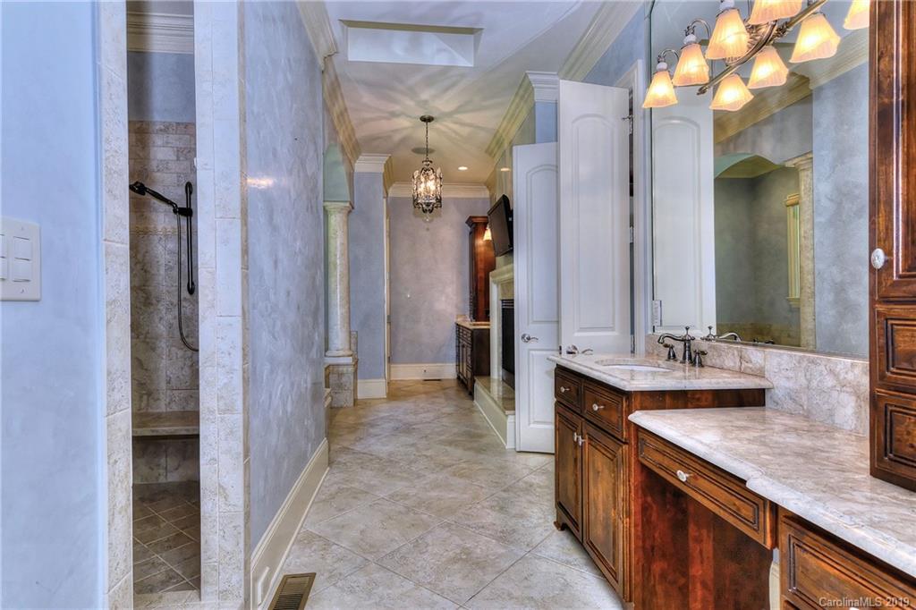 17415 Cabarrus Road Midland, NC 28107 - Photo 22 of 41 a bathroom with a double vanity sink and a mirror