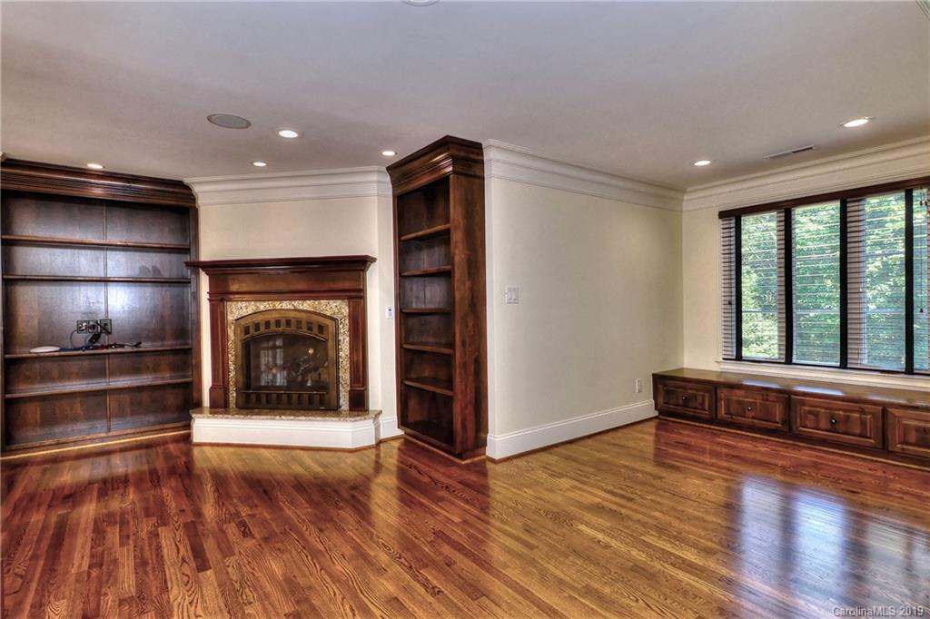 17415 Cabarrus Road Midland, NC 28107 - Photo 31 of 41 a living room with hard wood floors and a fireplace