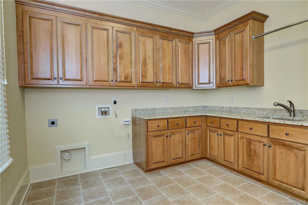 17415 Cabarrus Road Midland, NC 28107 - Photo 34 of 41 a kitchen with a sink and cabinets
