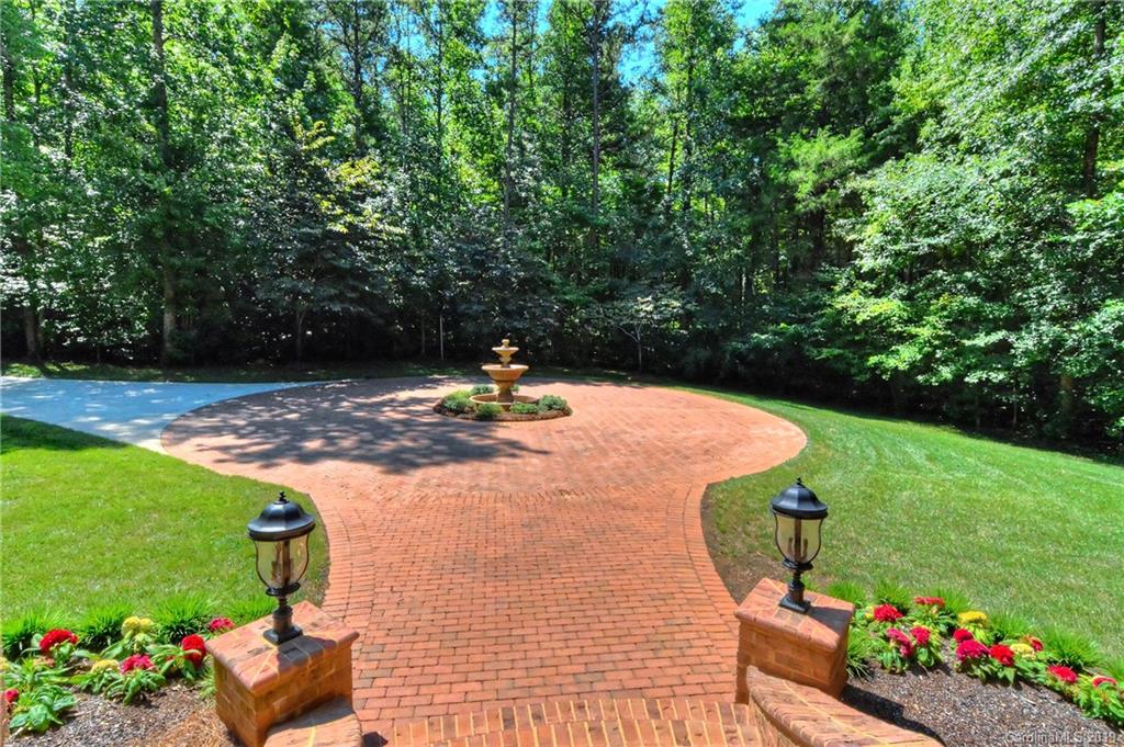 17415 Cabarrus Road Midland, NC 28107 - Photo 41 of 41 a view of a fire pit with large trees