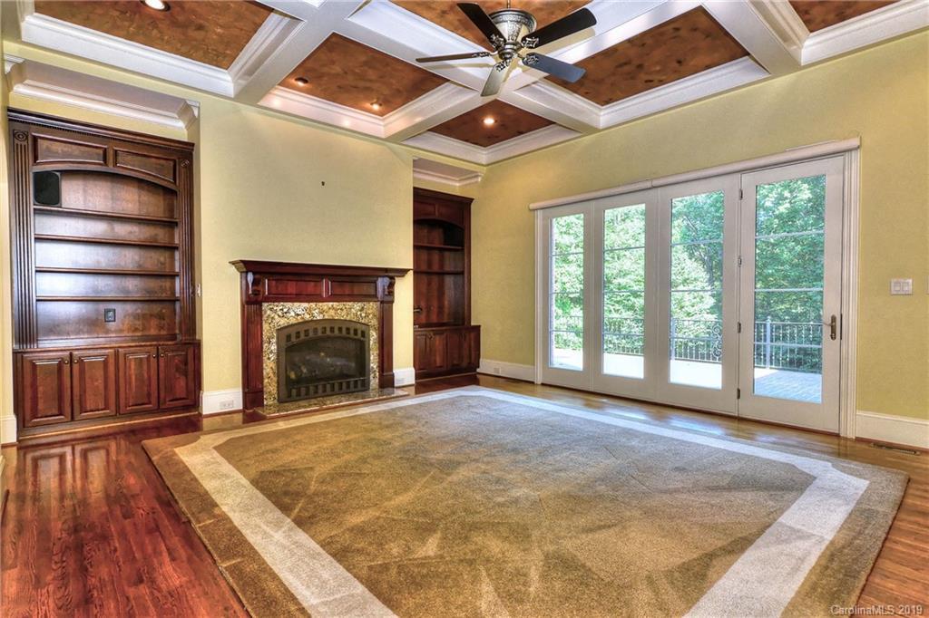 17415 Cabarrus Road Midland, NC 28107 - Photo 9 of 41 a view of an empty room with wooden floor fireplace and a window