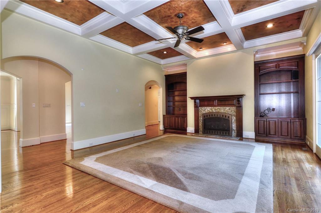 17415 Cabarrus Road Midland, NC 28107 - Photo 10 of 41 a view of an empty room with wooden floor and a fireplace