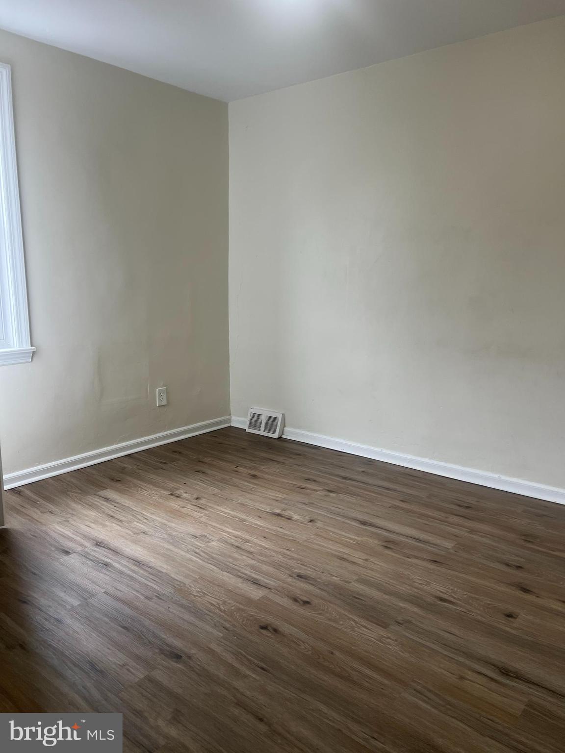 153 Margate Road Upper Darby, PA 19082 - Photo 5 of 7 a view of an empty room with wooden floor