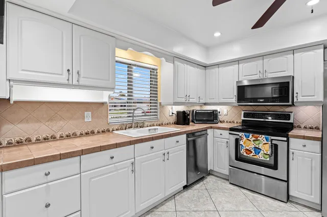 a kitchen with a sink and cabinets