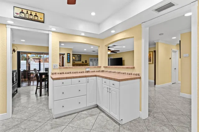 a kitchen with a cabinets and refrigerator