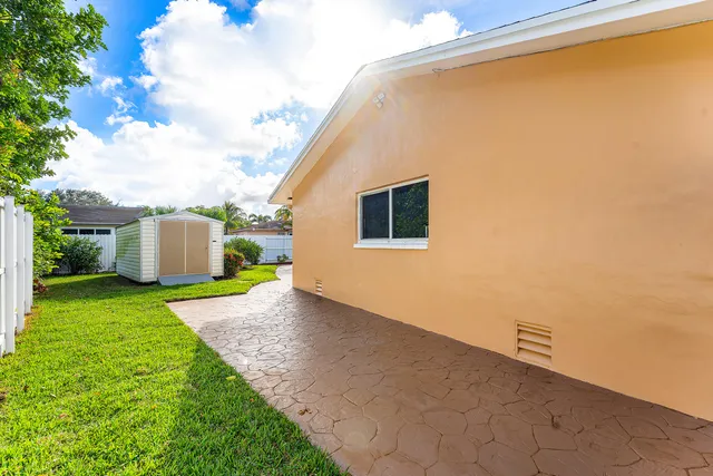 a view of a back yard with an outdoor space