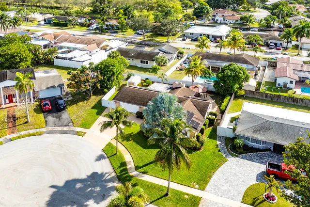 an aerial view of residential houses with outdoor space