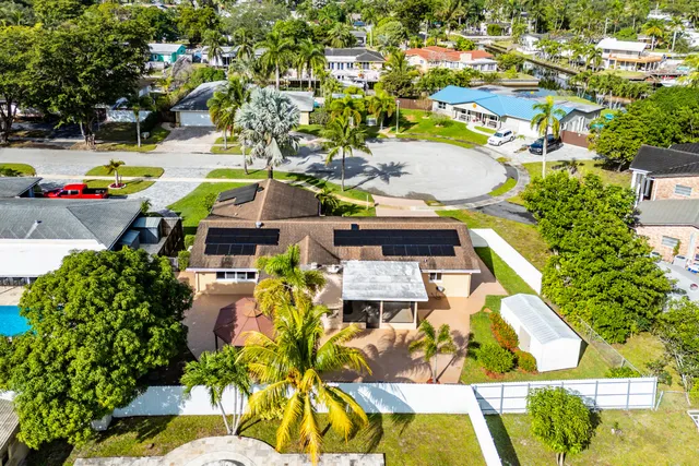an aerial view of houses and swimming pool