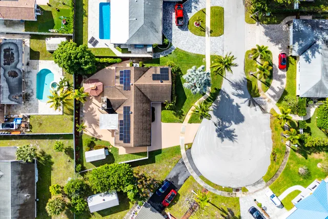 an aerial view of residential houses with outdoor space