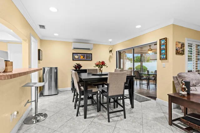 a dining room with furniture and window