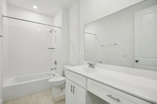 a bathroom with a sink a toilet and a bathtub