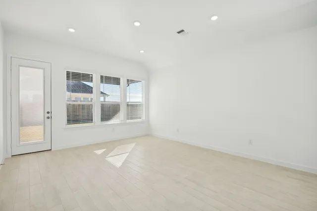 an empty room with windows